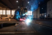 professional-industrial-welder-welding-metal-parts-in-metalworking-factory